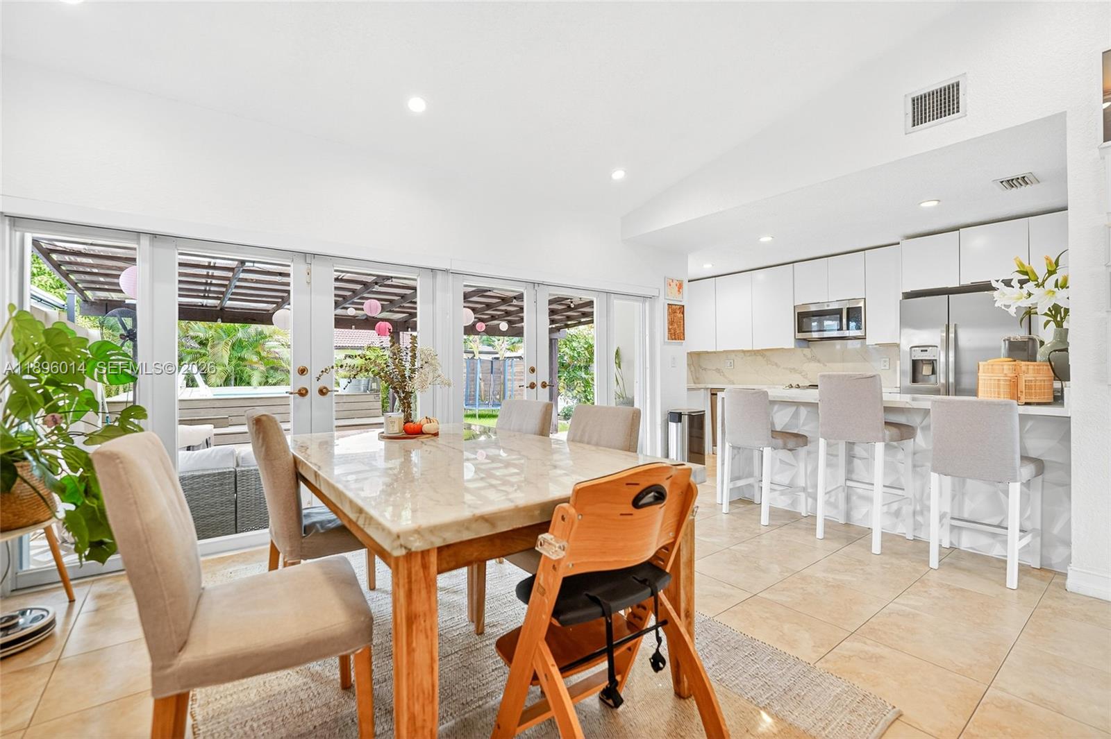 752 Northwest 134th Avenue Miami, FL 33182 - Photo 6 of 47 a dining room with furniture and a floor to ceiling window