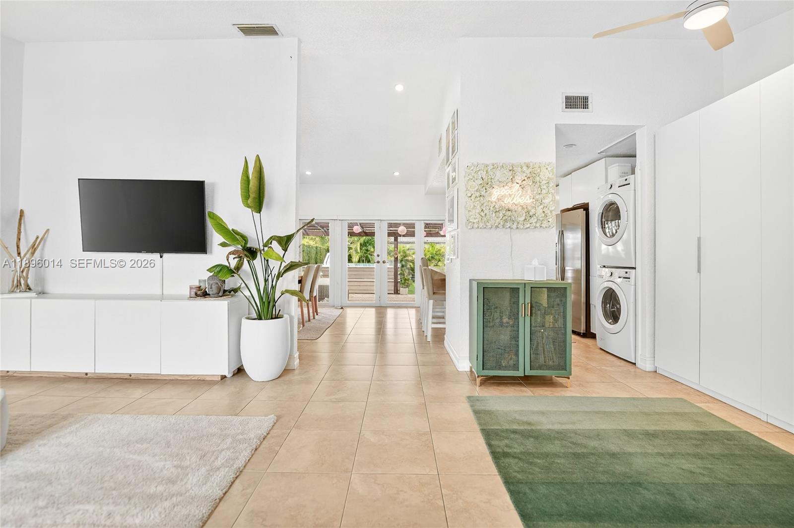 752 Northwest 134th Avenue Miami, FL 33182 - Photo 9 of 47 a living room with furniture a fireplace and a flat screen tv