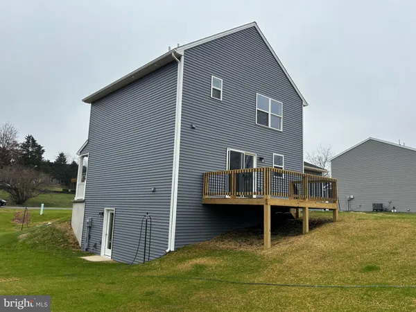 a backyard of a house with yard and trampoline