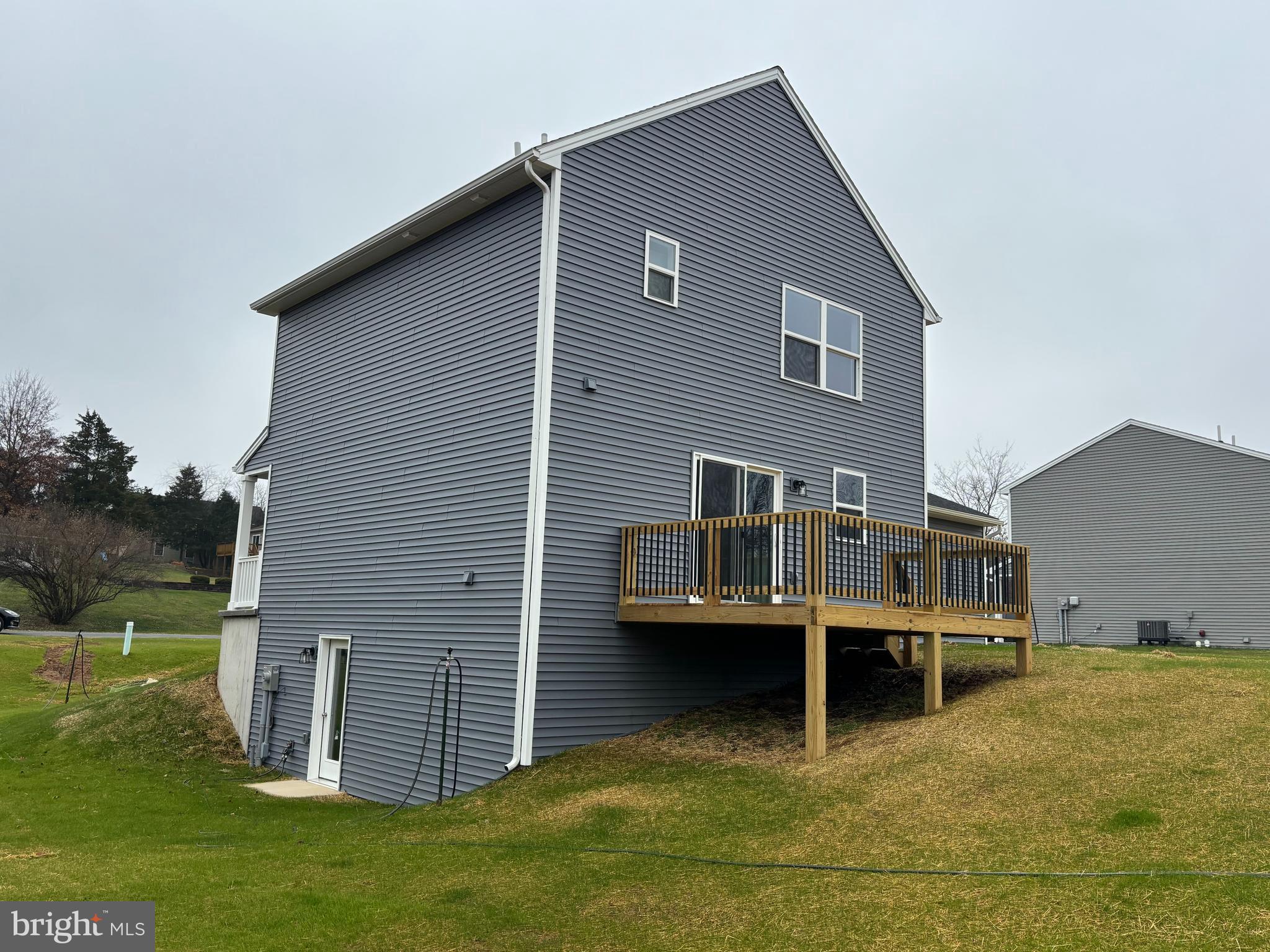 3746 Percy Avenue Chambersburg, PA 17202 - Photo 3 of 8 a backyard of a house with yard and trampoline