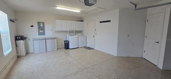 a view of a storage & utility room with closet window