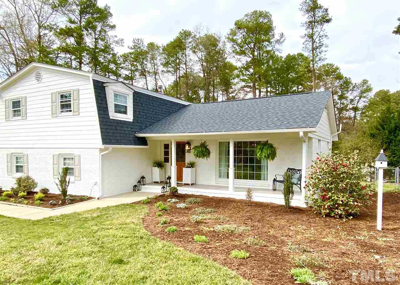 917 Deerfield Road Raleigh, NC 27609 - Photo 1 of 20 a front view of a house with a yard outdoor seating and garage