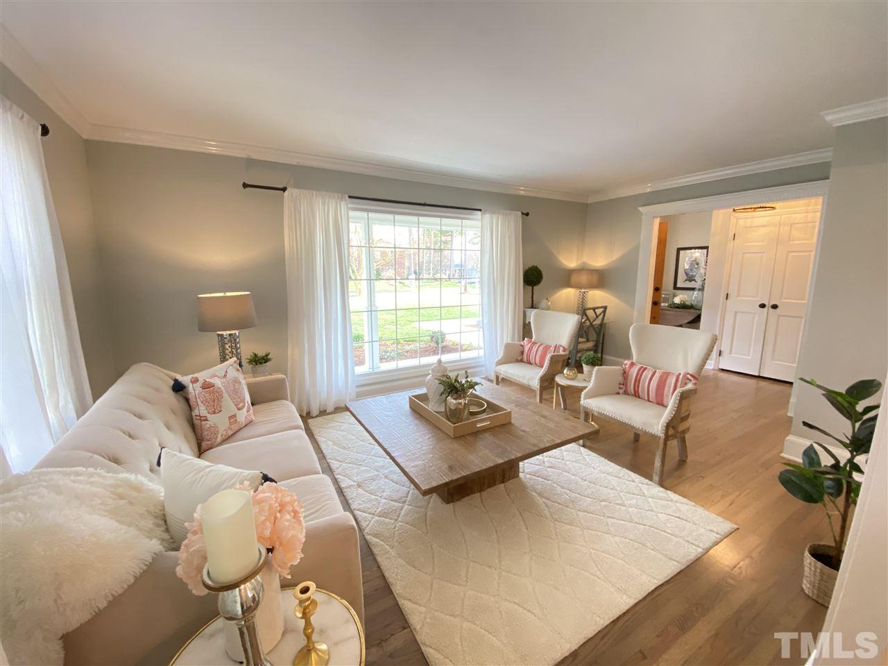 917 Deerfield Road Raleigh, NC 27609 - Photo 4 of 20 a living room with furniture and a window