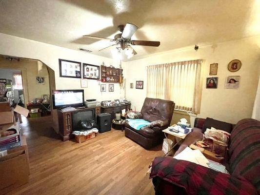 15300 West E Street Kerman, CA 93630 - Photo 4 of 13 a living room with furniture ceiling fan and a window