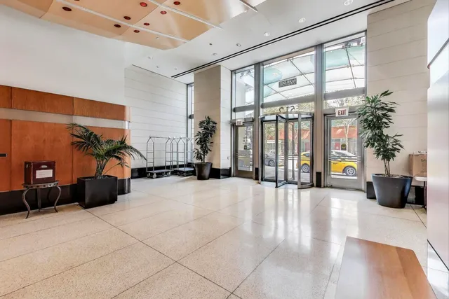 a living room with furniture and flowers
