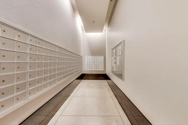 a view of swimming pool of water with tall buildings