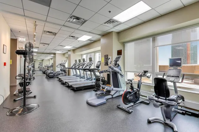 a room with furniture and a view of kitchen
