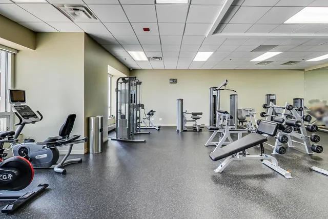 a living room with fireplace furniture and a flat screen tv