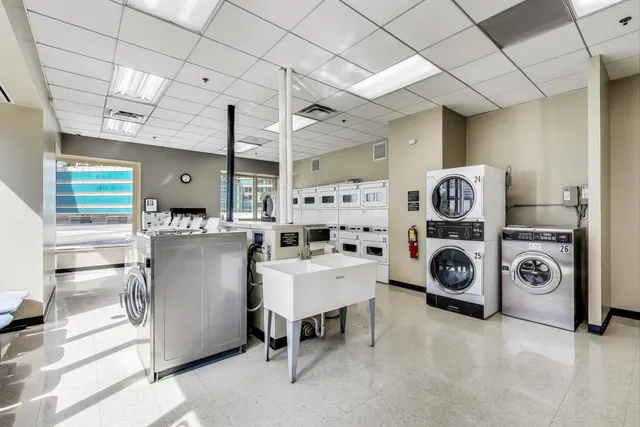 a large kitchen with a wooden floor and entryway