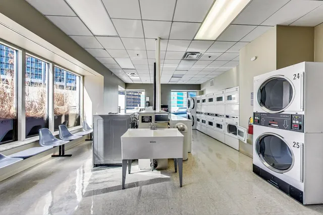 a view of a patio with dining table and chairs