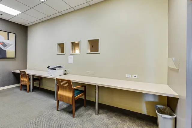 a view of a patio with dining table and chairs with wooden floor and plants