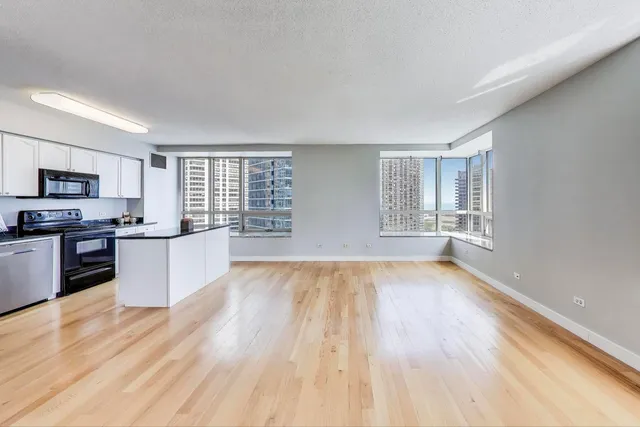 a view of kitchen with sink and wooden floor