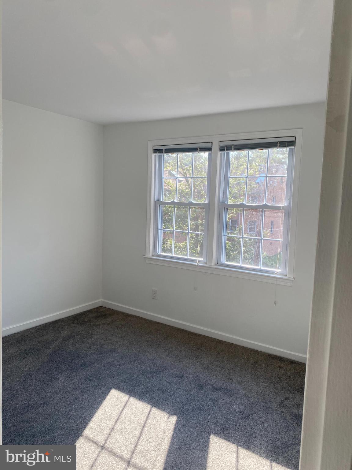 2206 Washington Avenue, Unit 302 Silver Spring, MD 20910 - Photo 11 of 26 an empty room with a window