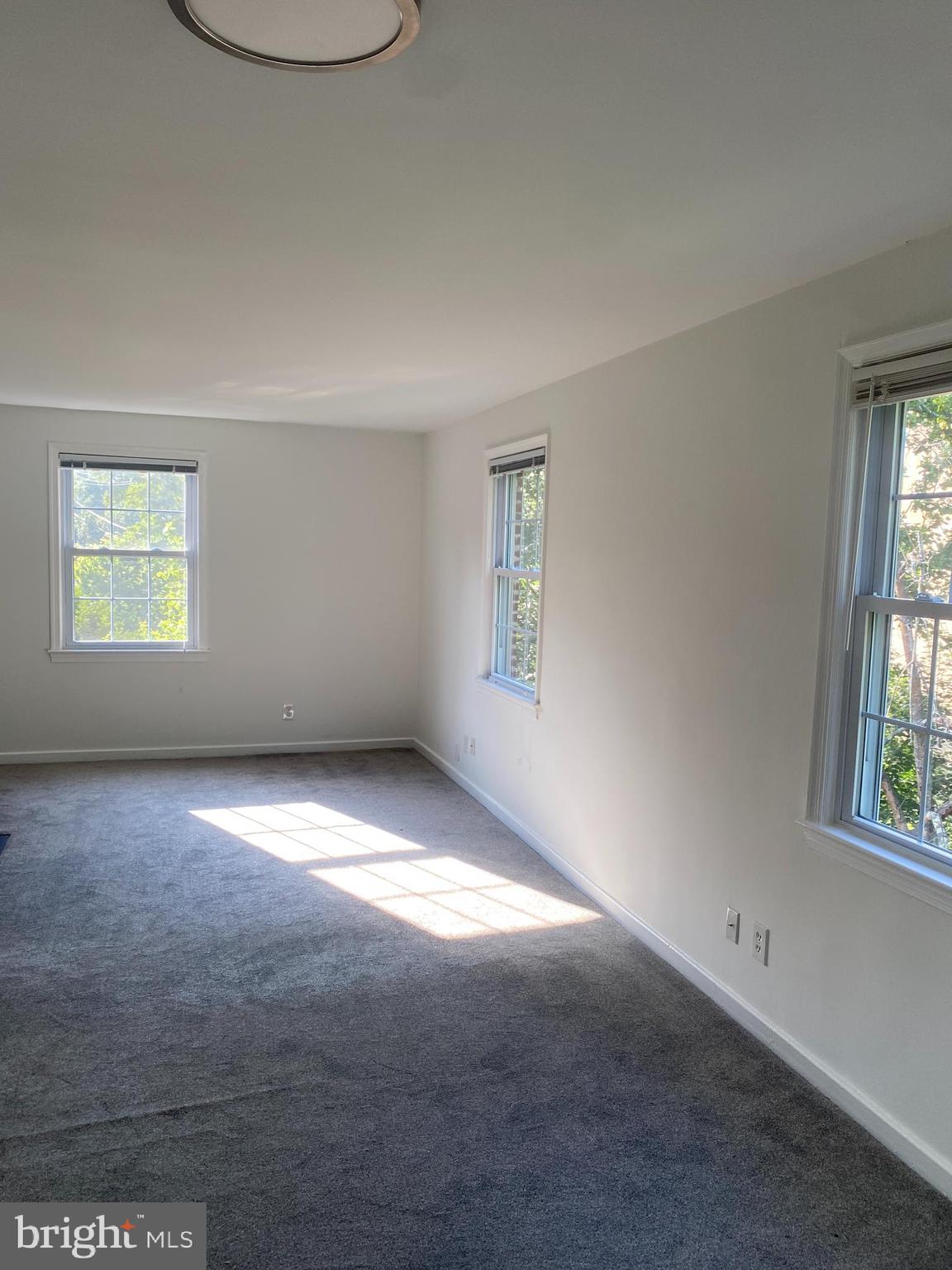 2206 Washington Avenue, Unit 302 Silver Spring, MD 20910 - Photo 17 of 26 an empty room with windows