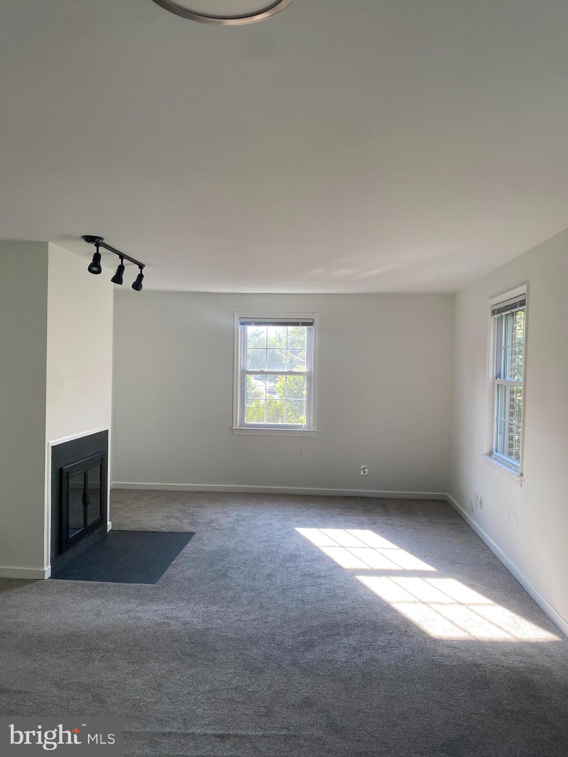 2206 Washington Avenue, Unit 302 Silver Spring, MD 20910 - Photo 18 of 26 an empty room with a empty space and windows