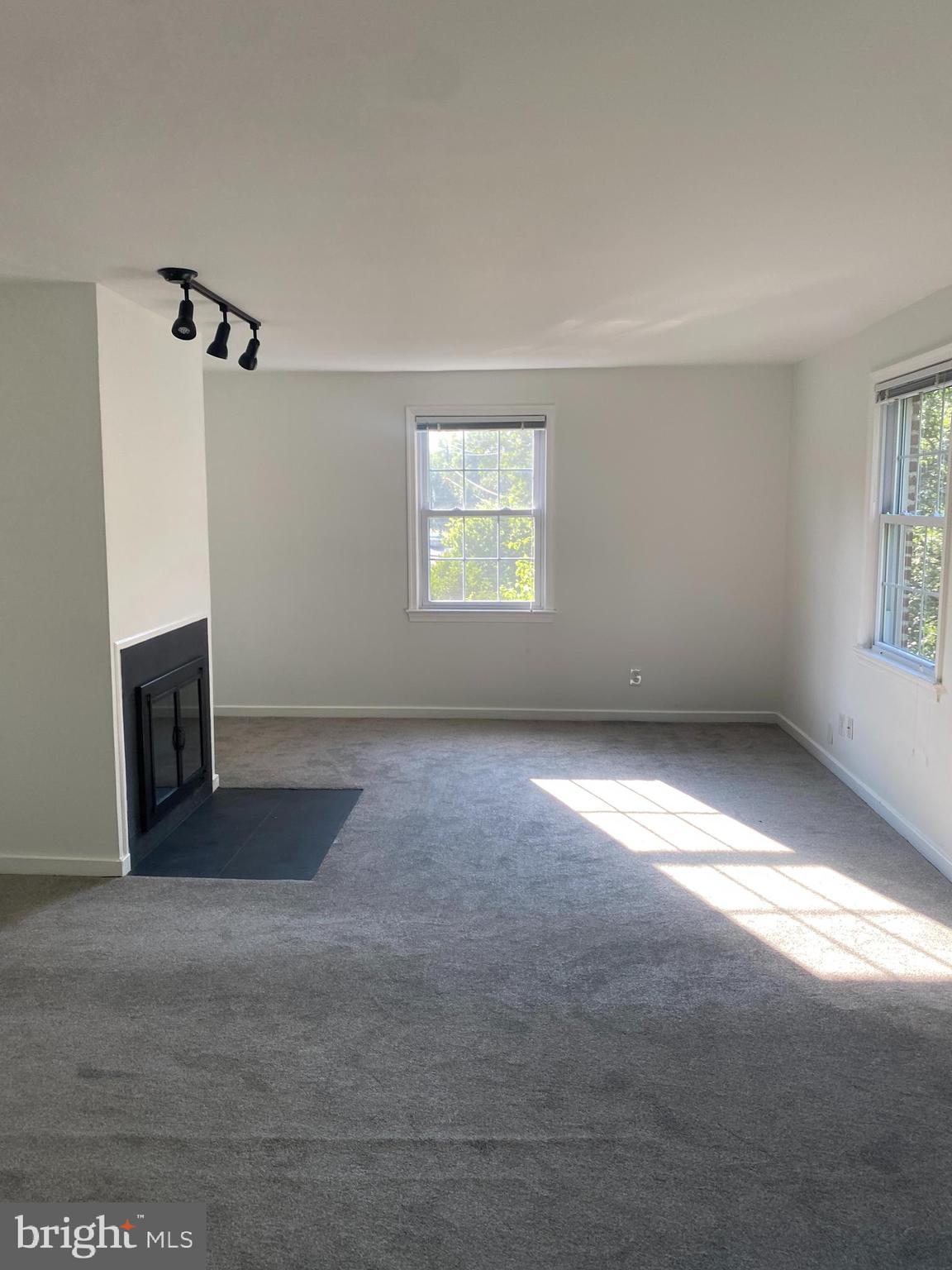2206 Washington Avenue, Unit 302 Silver Spring, MD 20910 - Photo 19 of 26 an empty room with windows