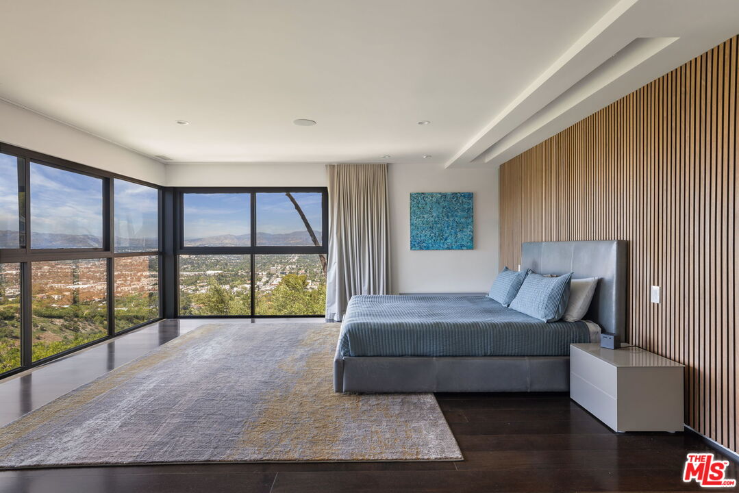 3337 Beverly Ranch Road Beverly Hills, CA 90210 - Photo 20 of 36 a living room with a large bed and a large window