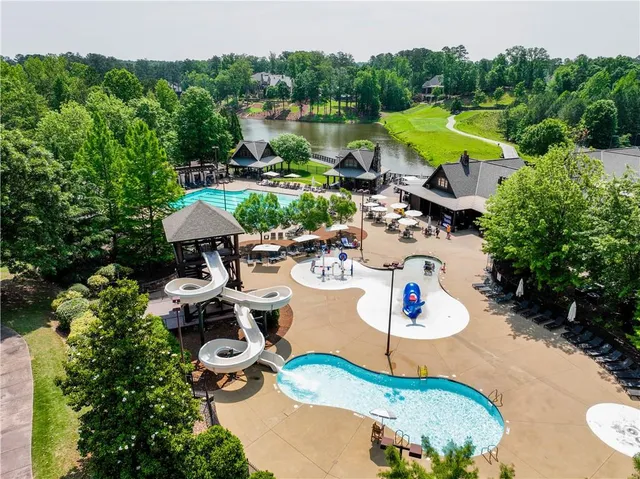 a view of a table and chairs in backyard