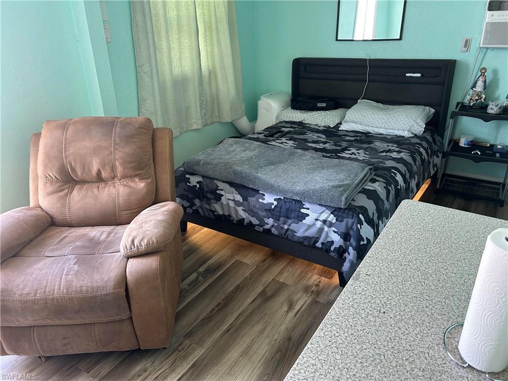 181 Pine Key Lane, Unit 29 Naples, FL 34114 - Photo 20 of 20 Bedroom featuring wood finished floors