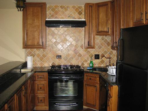 1197 Ranchview Court, Unit 1197 Buffalo Grove, IL 60089 - Photo 2 of 6 a kitchen with a stove and a refrigerator