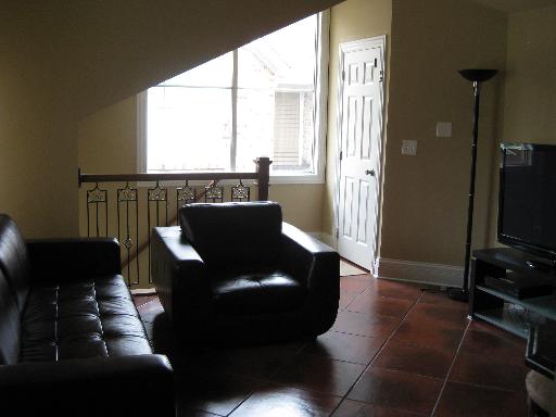 1197 Ranchview Court, Unit 1197 Buffalo Grove, IL 60089 - Photo 3 of 6 a living room with furniture and a flat screen tv