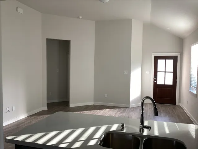 a kitchen with a sink and a window