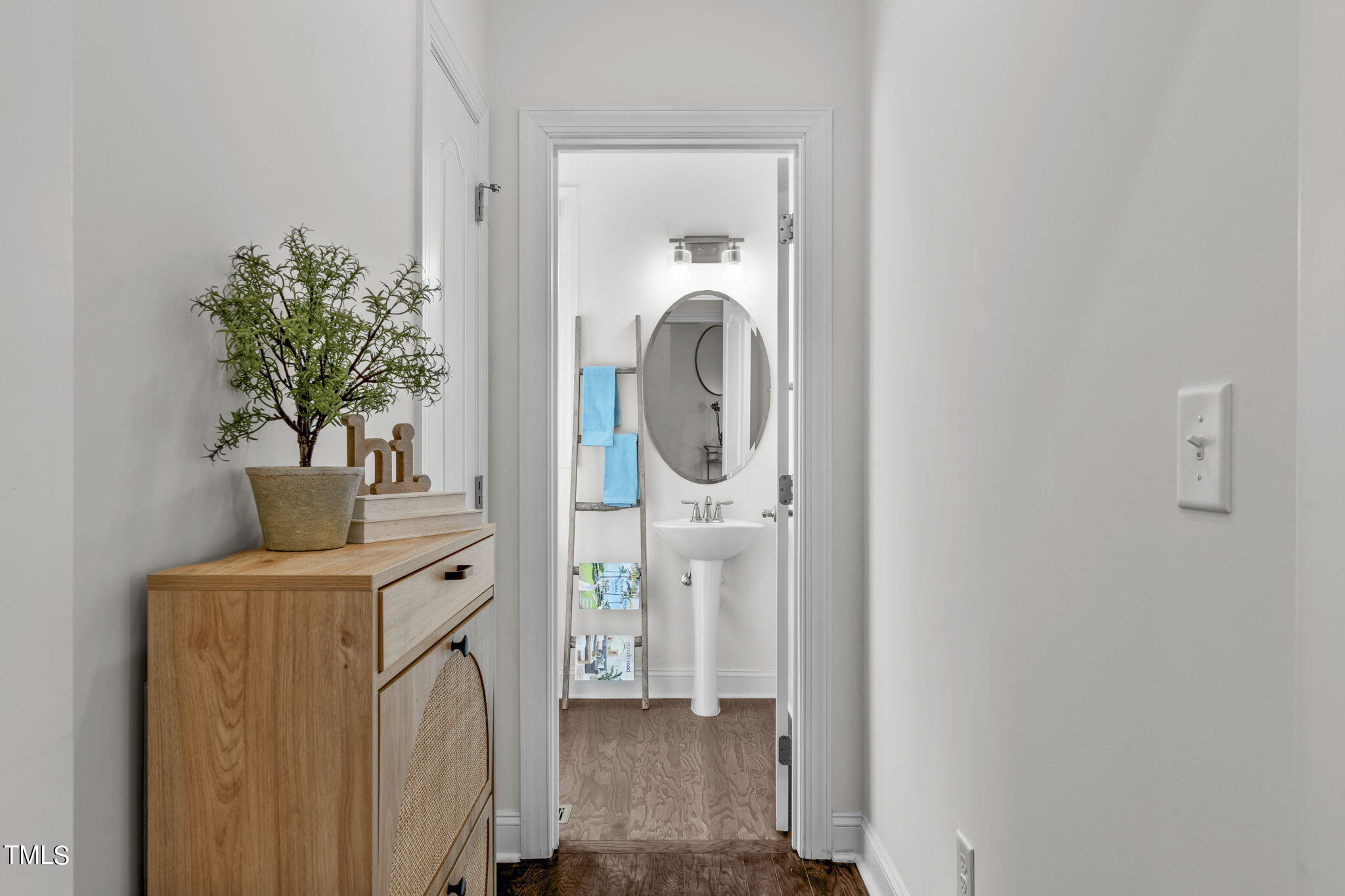 9716 Chris Drive Raleigh, NC 27603 - Photo 9 of 41 Hallway to powder room on the main level