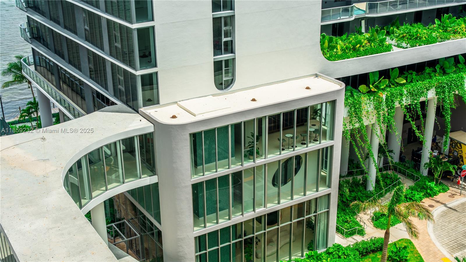 700 Northeast 24th Street, Unit 2705 Miami, FL 33137 - Photo 16 of 43 a view of a wooden deck with a large window