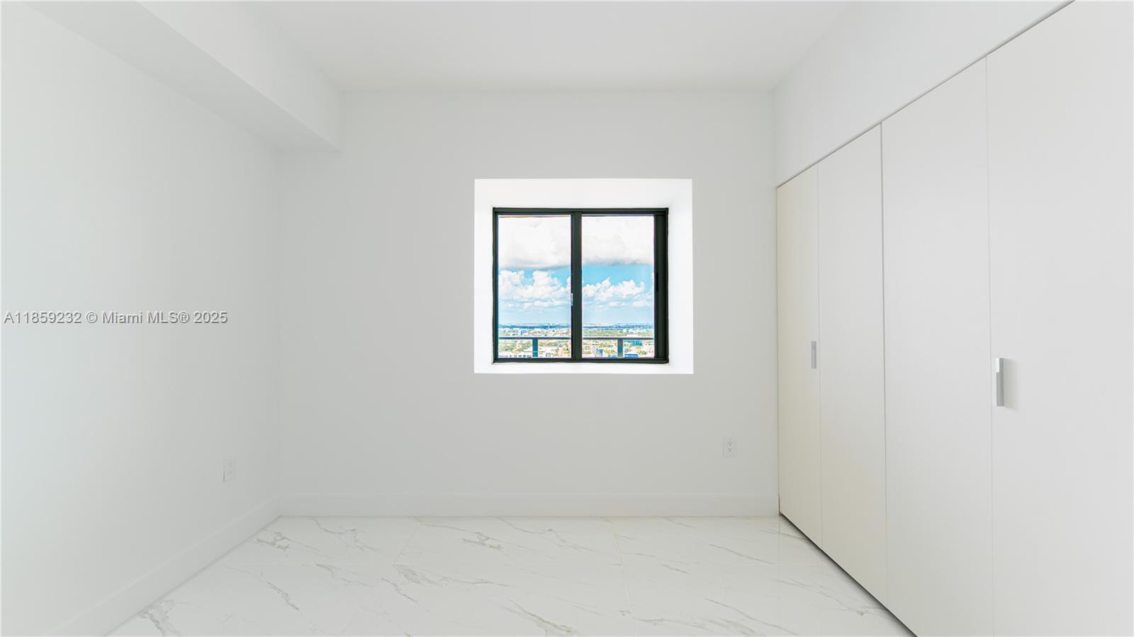 700 Northeast 24th Street, Unit 2705 Miami, FL 33137 - Photo 20 of 43 an empty room with a window