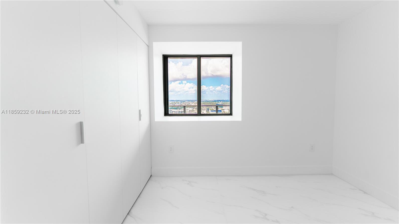 700 Northeast 24th Street, Unit 2705 Miami, FL 33137 - Photo 25 of 43 an empty room with a window