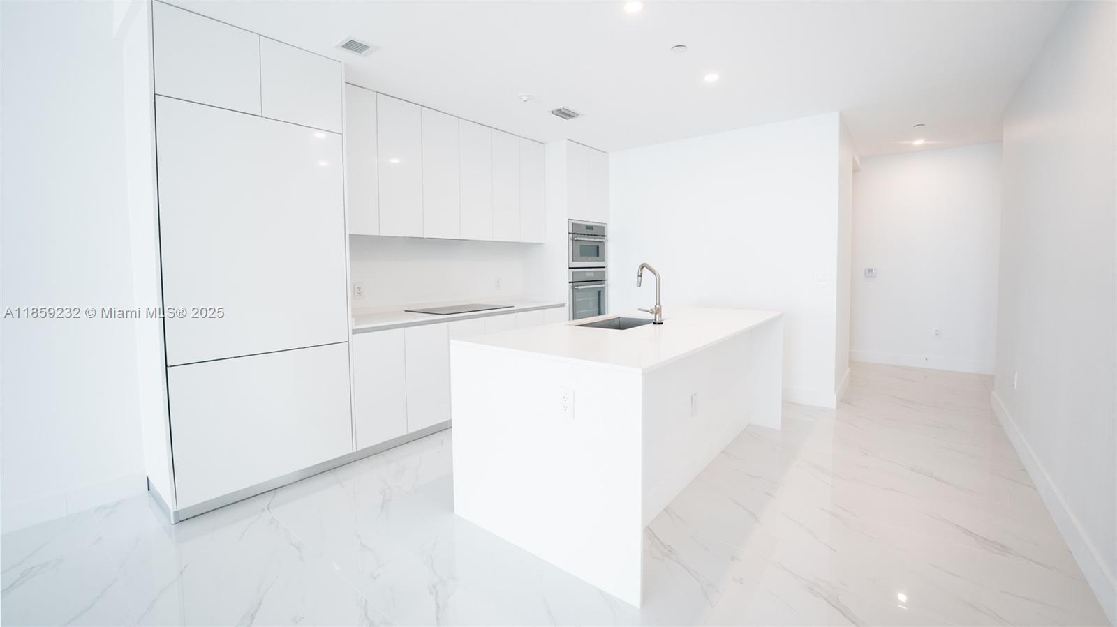 700 Northeast 24th Street, Unit 2705 Miami, FL 33137 - Photo 30 of 43 a bathroom with a sink a shower and a mirror