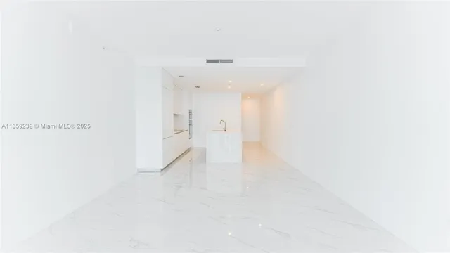 a bathroom with a double vanity sink and mirror