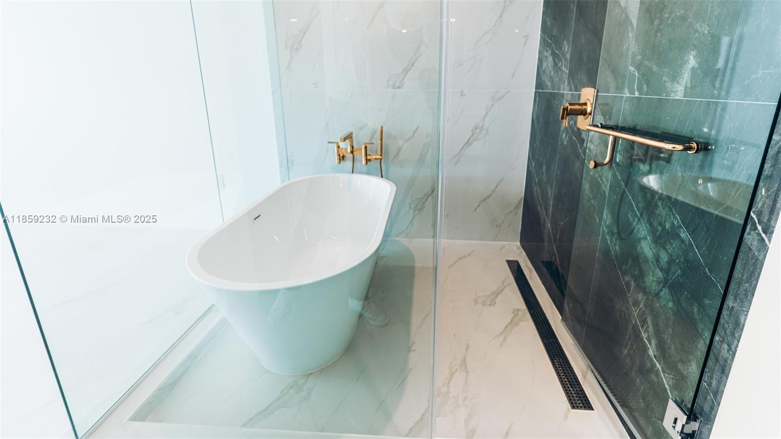 700 Northeast 24th Street, Unit 2705 Miami, FL 33137 - Photo 34 of 43 a bathroom with a sink and mirror