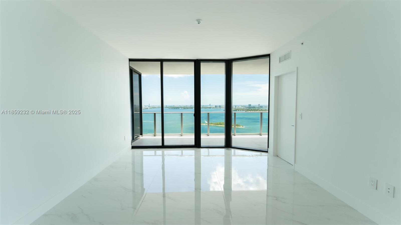 700 Northeast 24th Street, Unit 2705 Miami, FL 33137 - Photo 41 of 43 a view of an empty room with a window