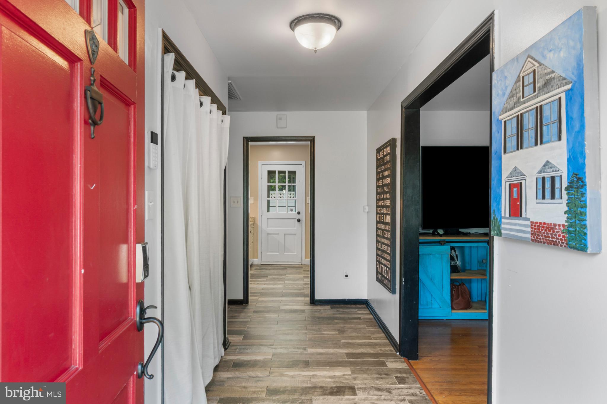 117 Oakwood Road Edgewater, MD 21037 - Photo 4 of 52 Entryway featuring a bright red door with black ha