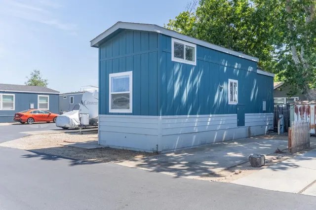 a kitchen with a refrigerator stove and sink