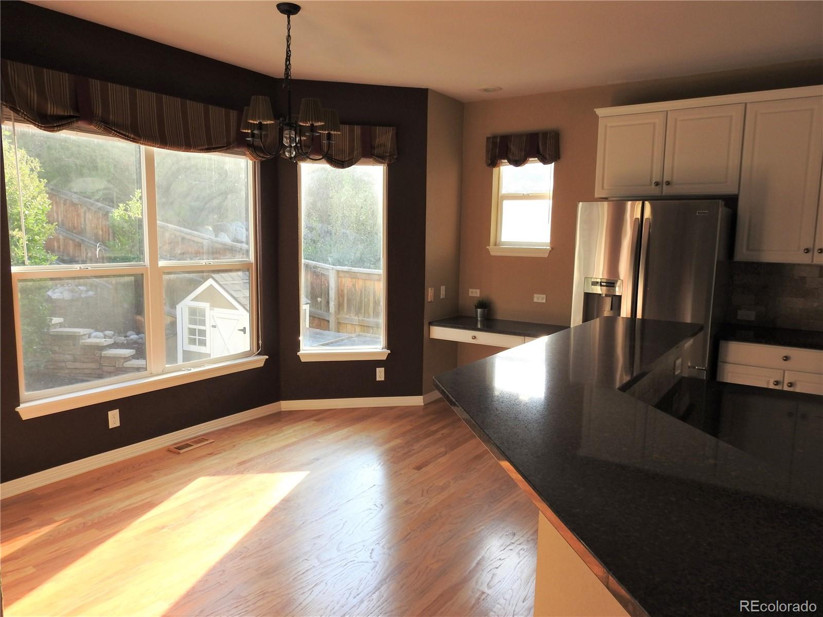 455 West Angus Way Highlands Ranch, CO 80129 - Photo 10 of 27 a view of a kitchen with a sink and a window