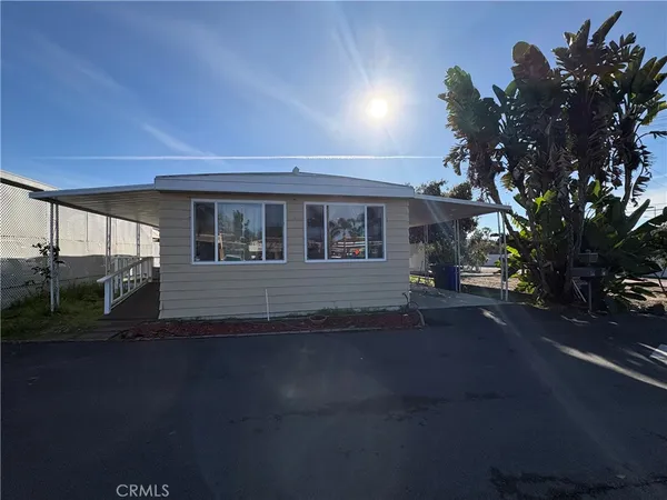a view of a house with a tree