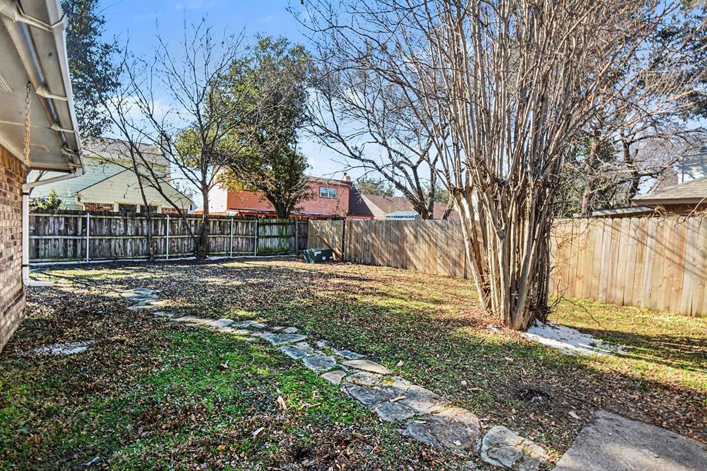 2433 Hallmark Street Grand Prairie, TX 75052 - Photo 13 of 15 a view of backyard of a house
