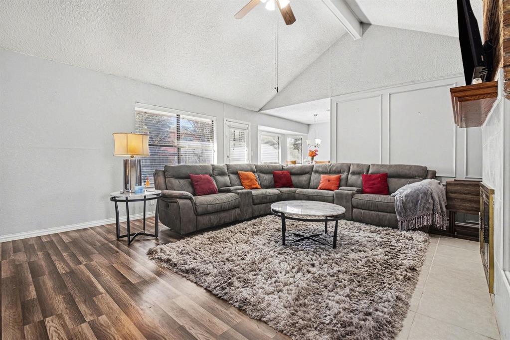 2433 Hallmark Street Grand Prairie, TX 75052 - Photo 7 of 15 a living room with furniture a rug and a chandelier