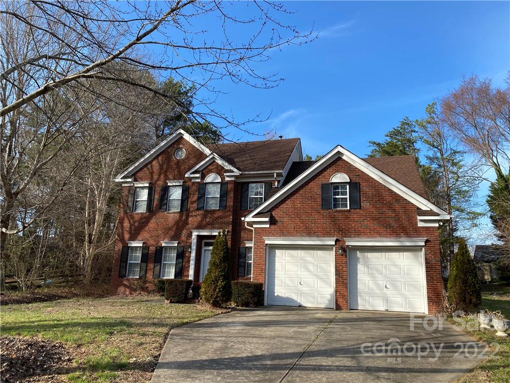 7306 Reedy Creek Road Charlotte, NC 28215 - Photo 1 of 15 a front view of a house with a yard