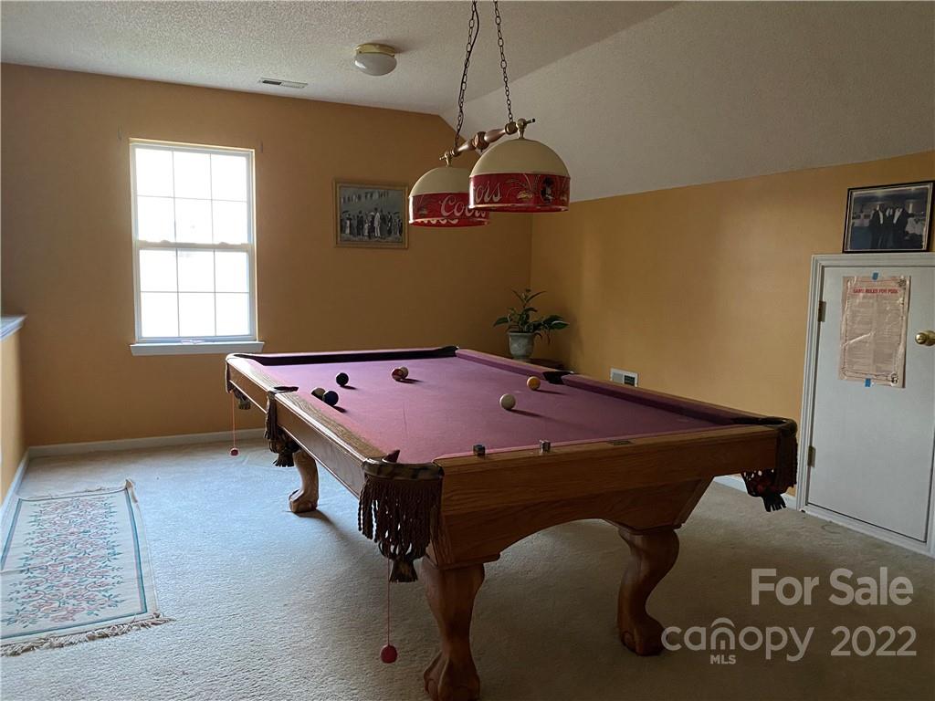 7306 Reedy Creek Road Charlotte, NC 28215 - Photo 13 of 15 a room with pool table and windows