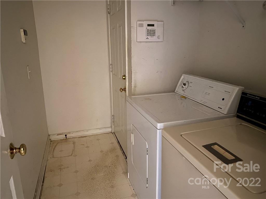 7306 Reedy Creek Road Charlotte, NC 28215 - Photo 14 of 15 a utility room with dryer and washer
