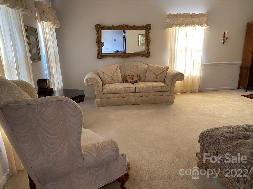 7306 Reedy Creek Road Charlotte, NC 28215 - Photo 3 of 15 a living room with furniture and a window