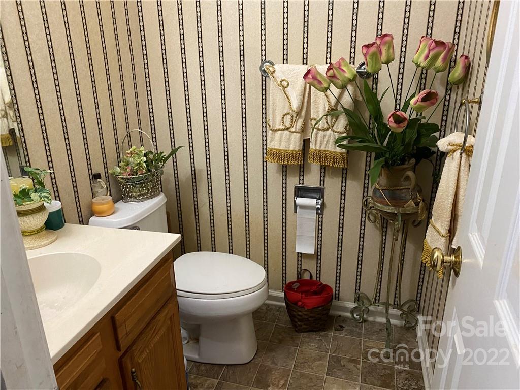 7306 Reedy Creek Road Charlotte, NC 28215 - Photo 7 of 15 a bathroom with a sink toilet and shower