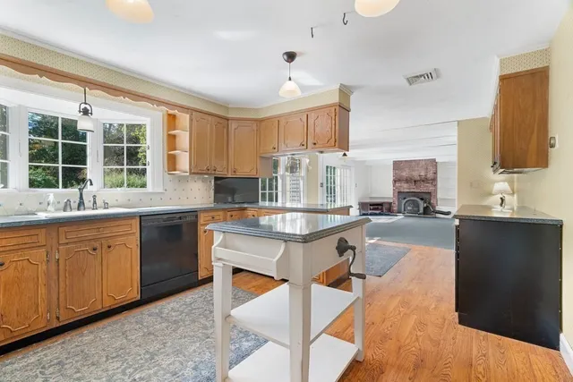 a kitchen with granite countertop lots of counter top space and sink