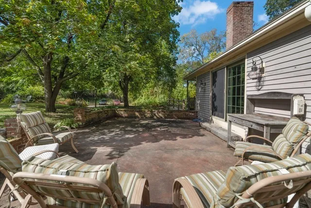 a view of backyard with outdoor seating