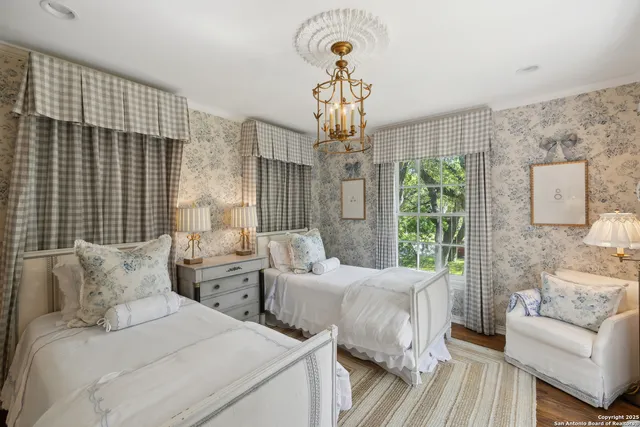 a living room with furniture and a ceiling fan