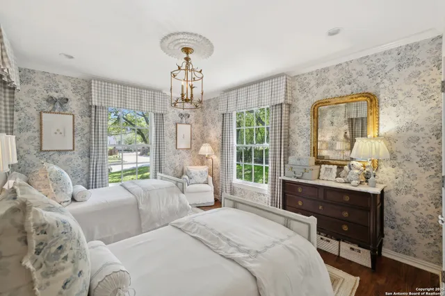 a front view of a house with plants