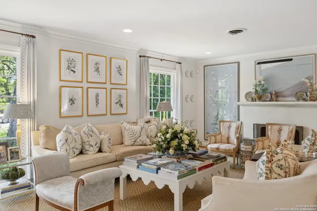 a view of a dining room with furniture and a chandelier